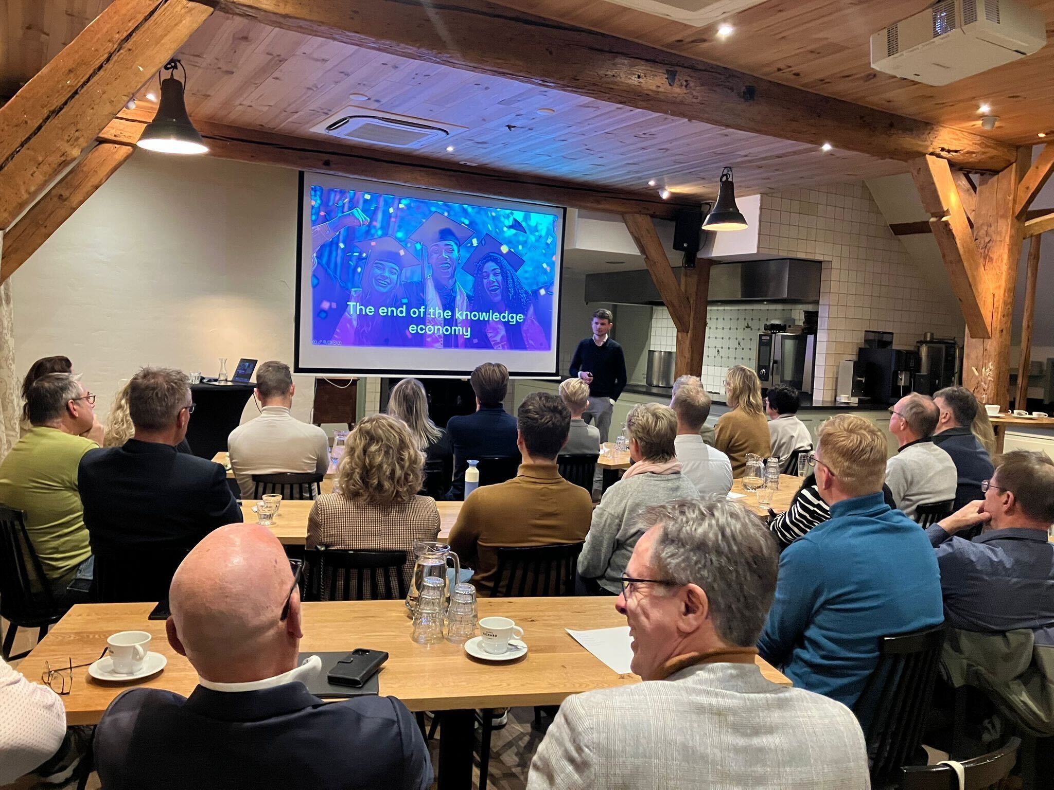 Wesley giving a keynote to a business audience at a network event